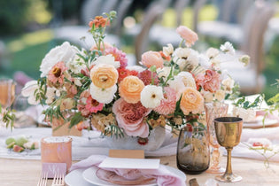 A trendy pink, peach, and white DIY wedding centerpiece