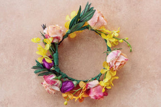 pink, hot pink, yellow, and orange flower crown flat lay
