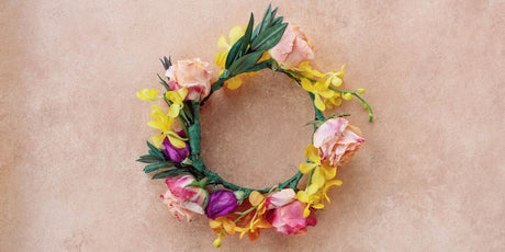 pink, hot pink, yellow, and orange flower crown flat lay
