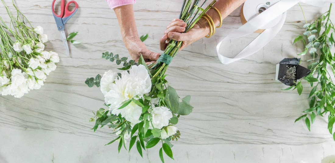 woman creating a DIY wedding bouquet