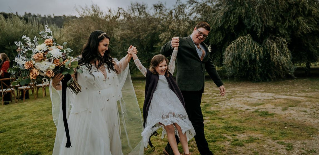 bride and groom swinging little girl at a San Francisco AirBnB elopement