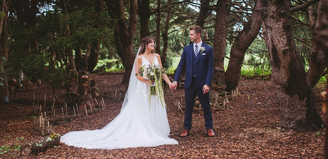 bride and groom in forest for their outdoor wedding