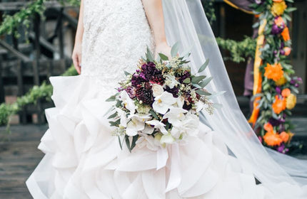 bride holding a sustainably made bridal bouquet