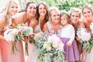 spring arrangements bride and bridesmaids standing together