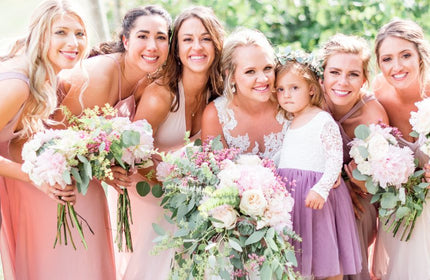 spring arrangements bride and bridesmaids standing together