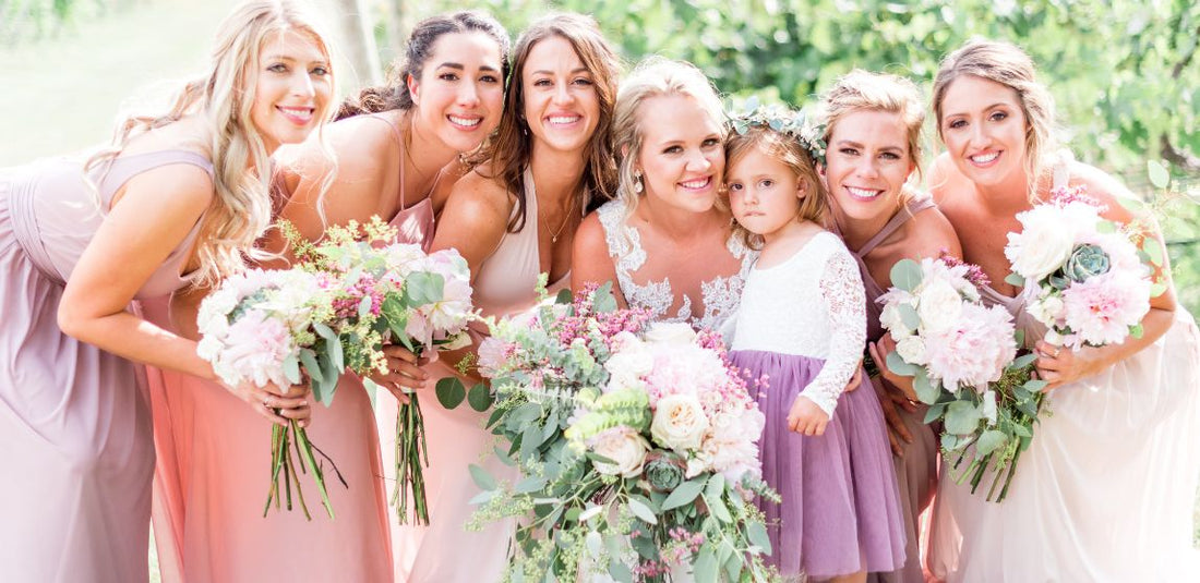 spring arrangements bride and bridesmaids standing together