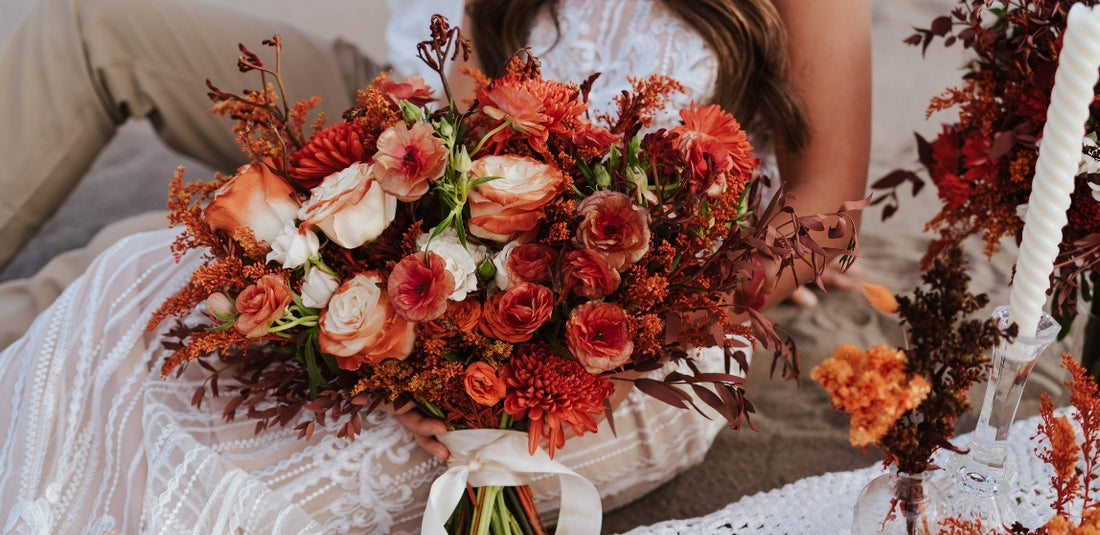 Desert Orange Bridal bouquet held in hand by bride