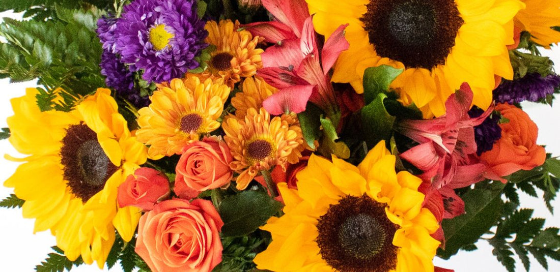 Sunflowers with other yellow and orange flowers