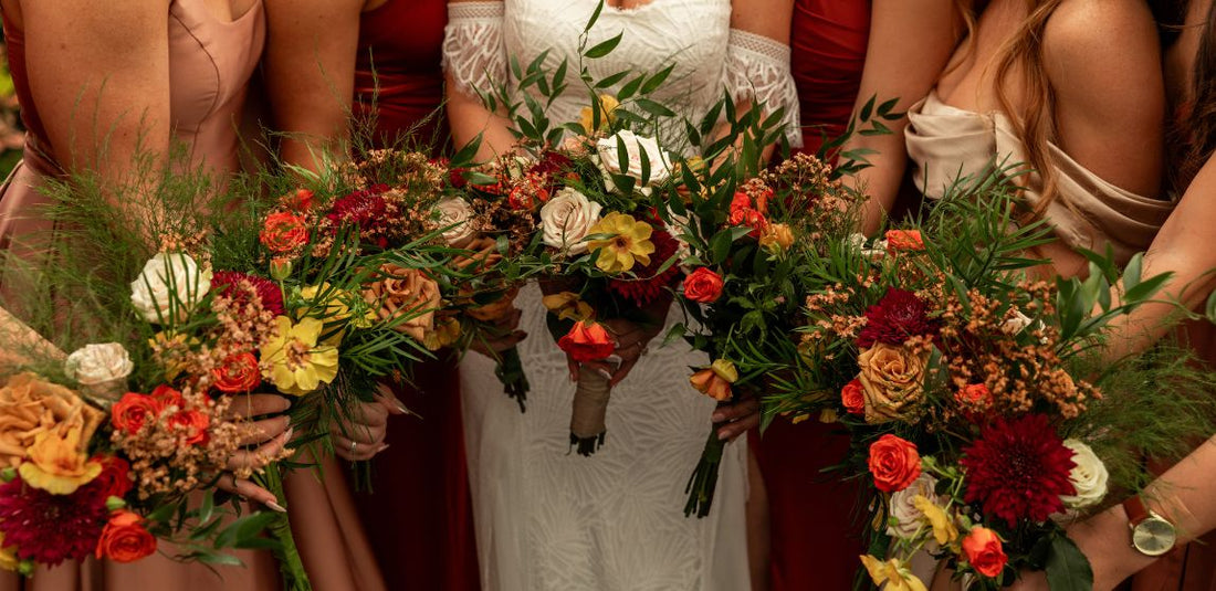 bride with bridesmaids holding their bridal bouquets