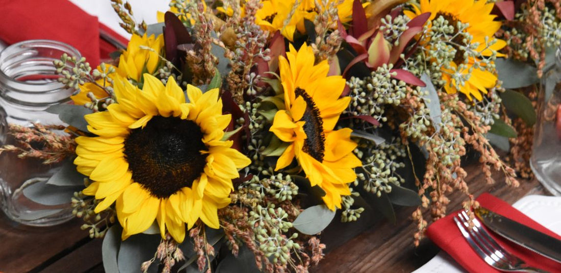 yellow sunflower arrangement with greenery
