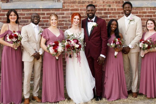 bride and groom in line with their bridesmaids and groomsmen