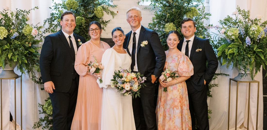 Bride and groom standing at alter with two other couples next to them