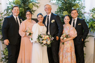 Bride and groom standing at alter with two other couples next to them