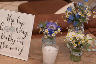 baby shower baby boy donut sprinkle end table with blue and white flowers