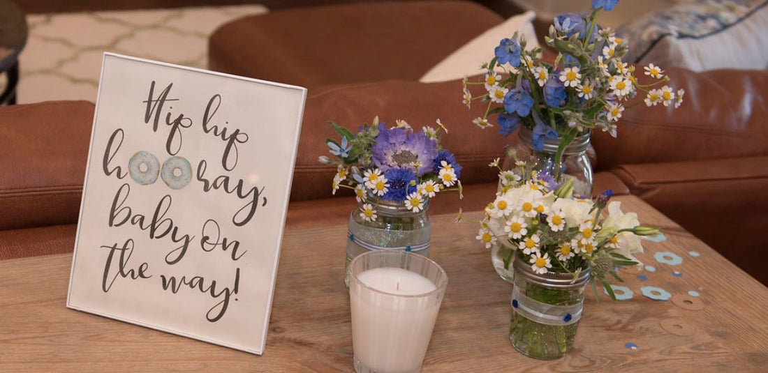 baby shower baby boy donut sprinkle end table with blue and white flowers