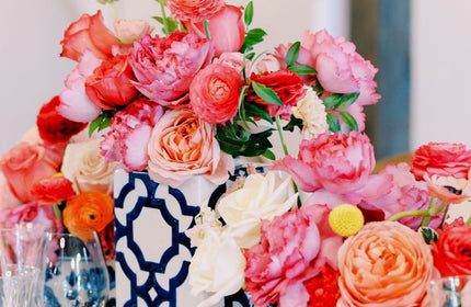 flower centerpieces with pink and hot pink flowers in blue vases