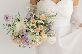 pastel ethereal garden bridal bouquet being held by bride