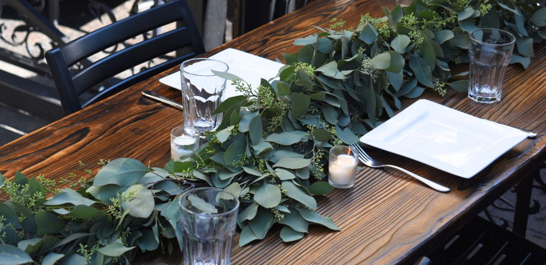 Eucalyptus Garland on a table with white plates and silverware