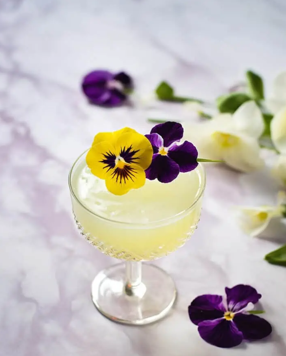 Edible flowers in a cocktail drink