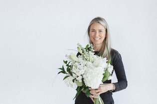 liza roeser holding white bouquet