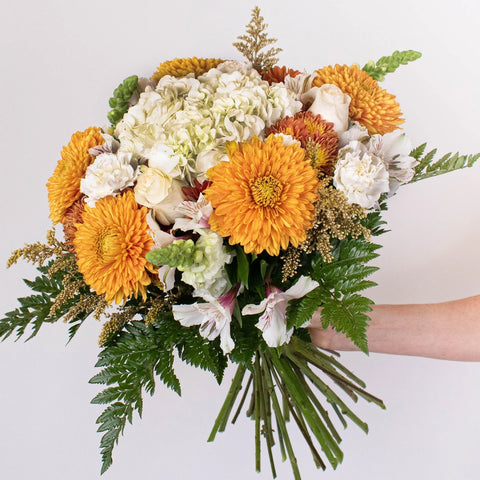 Gathering Place Orange and White Flower In Hand