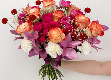 Cupid's Flirty Pink Flower Bouquet Hand - Image