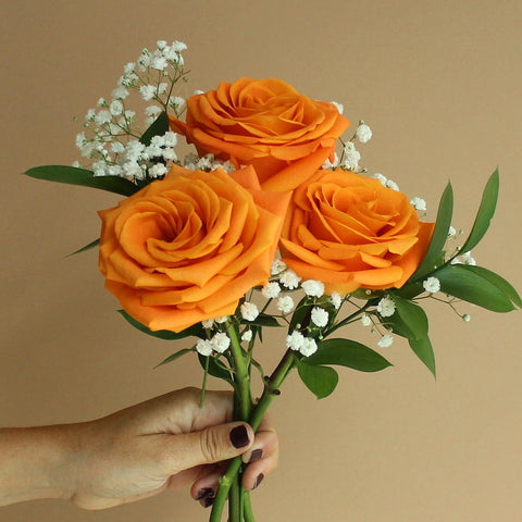Fundraiser Orange Flowers Bunch in Hand