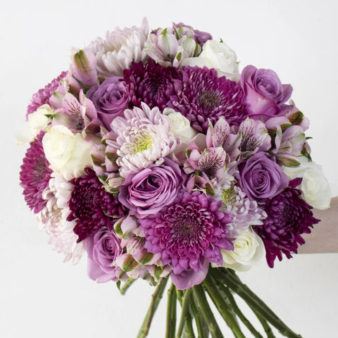 Roses Lavender Wholesale Flower Bunch in a hand