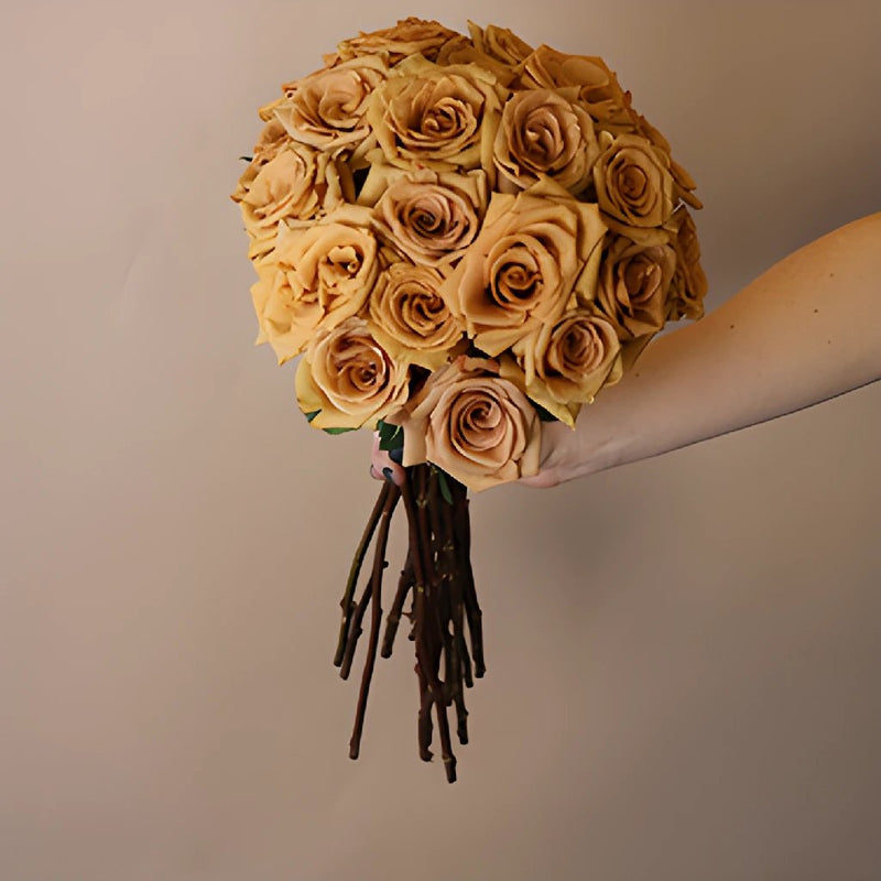 Toffee Wholesale Rose Bunch in a hand
