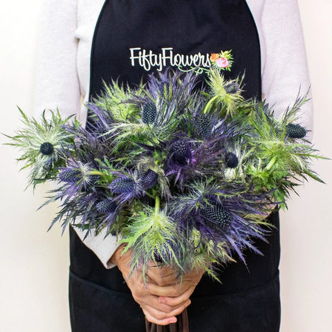 Deep Blue Thistle Wholesale Flower Bunch In a Hand