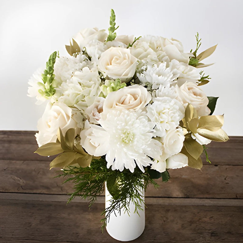 white flower centerpiece with white roses and gold flowers